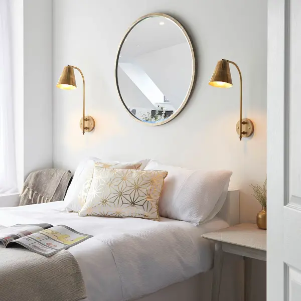 Radha Wall Light in Brass Finish